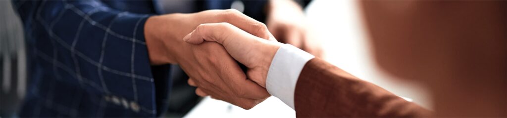 An image if two people shaking hands